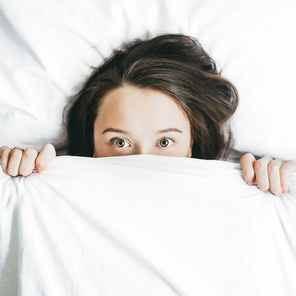 Woman waking up in the morning after good sleep