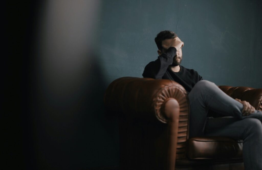 man stressed in chair