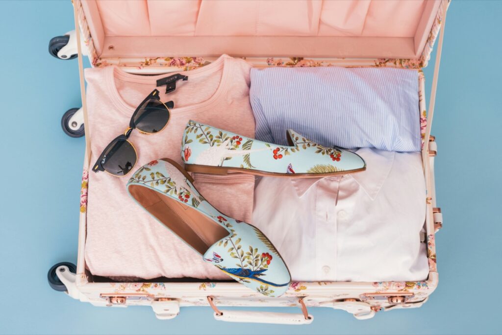 Woman packing her bag for a trip